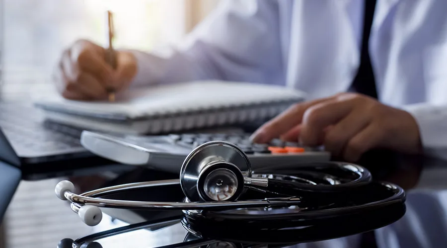 getty 1331967962 doctor doing taxes 900x500 1